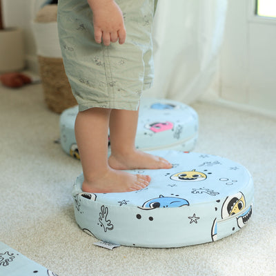 Kid balancing on Baby Shark™ x Roo & You™ Stepping Stones during playtime.