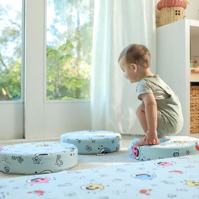 Toddler balancing on Baby Shark™ x Roo & You™ Stepping Stones, modular foam play furniture.